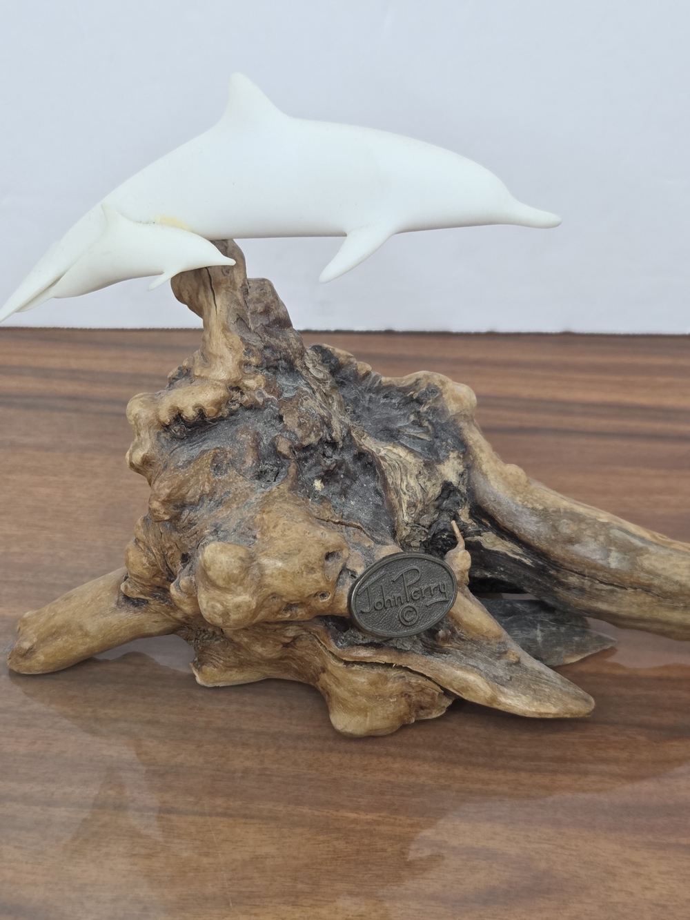 White Dolphin Duo Sculpture on Driftwood Base by John Perry